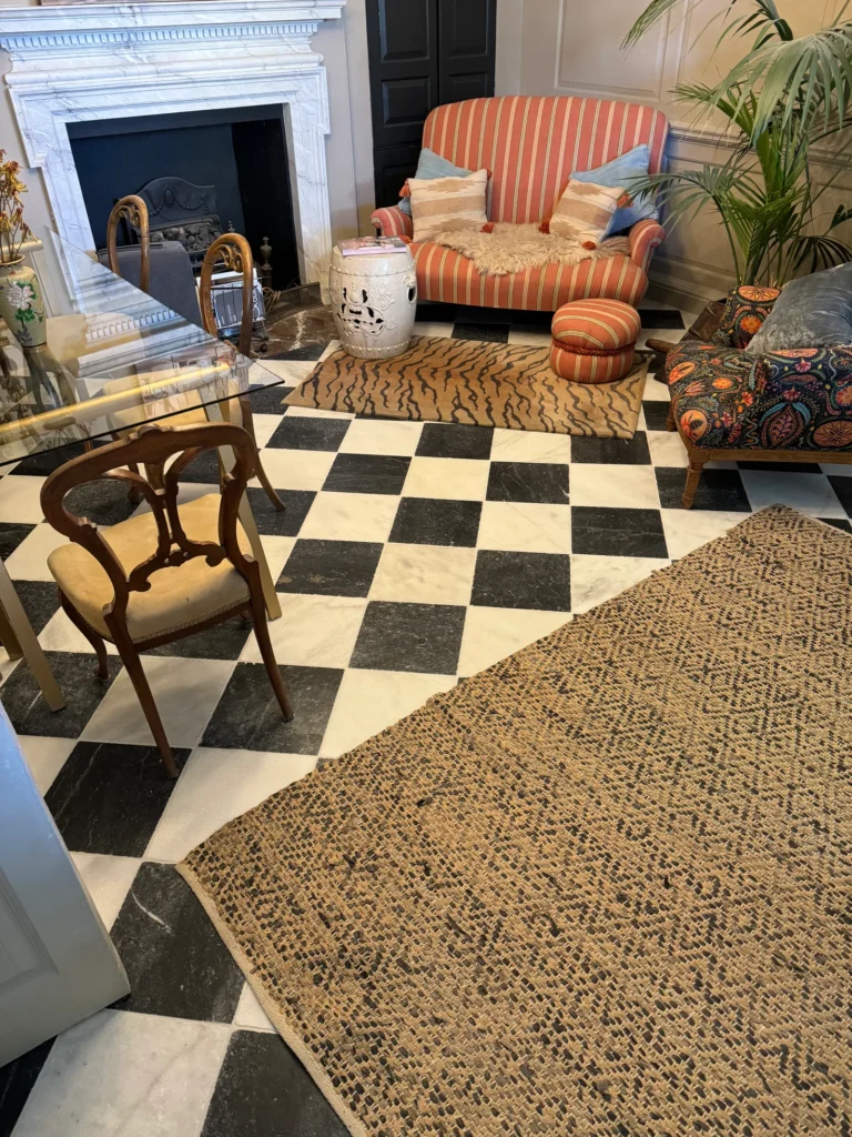 Black and white checkered floor tiles installed by Stamford tiler in a living room covering Stamford, Oakham and Uppingham.